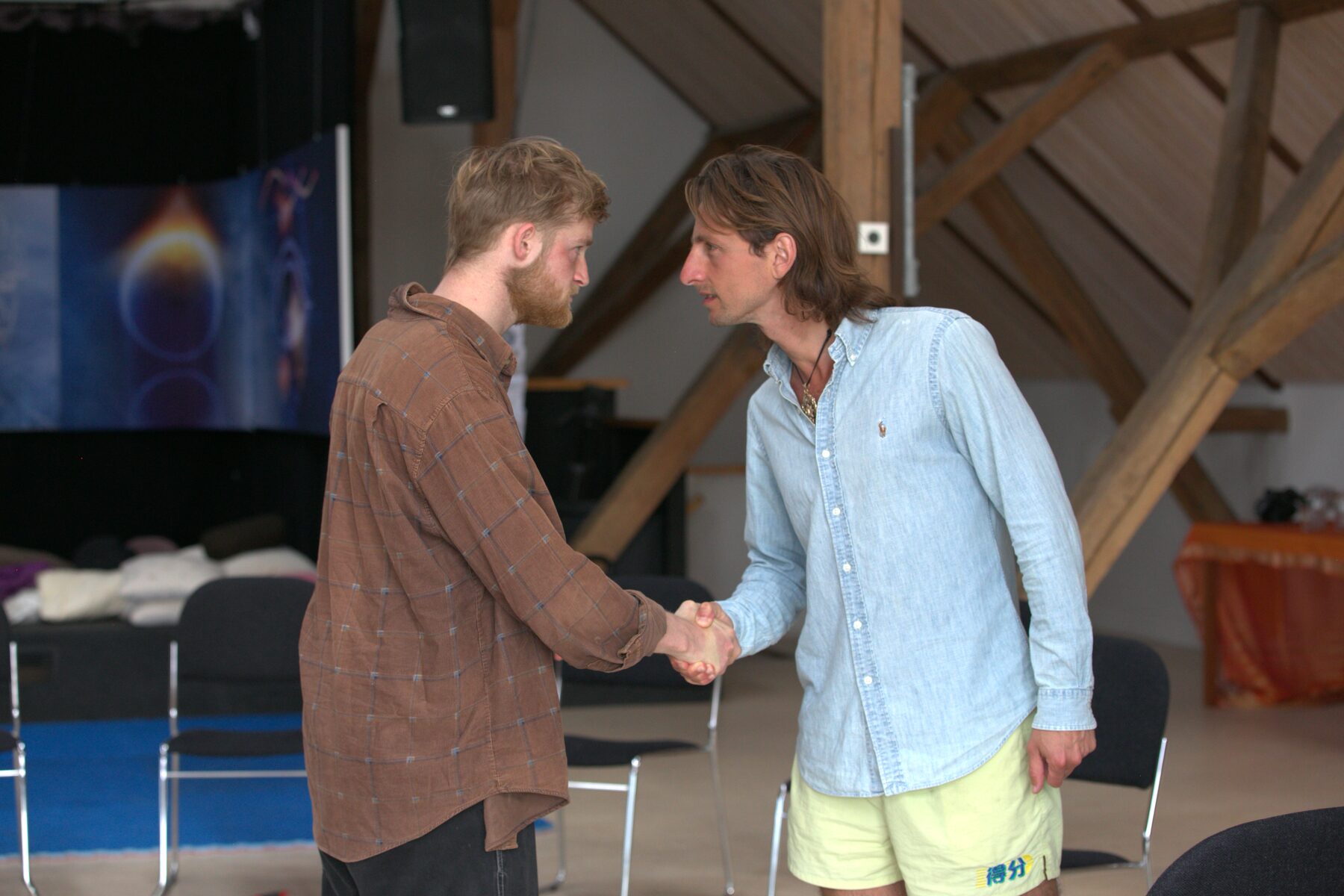 Giel meeting a man eye to eye at a gathering